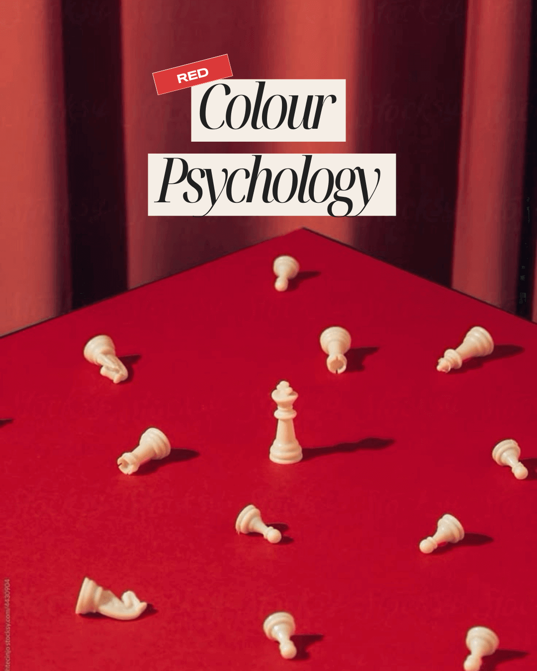White chess queen standing upright among fallen white chess pieces on a red surface with a red curtain backdrop.