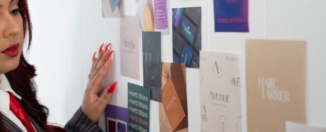 Creative team reviewing mockups – branding tips for service-based businesses.