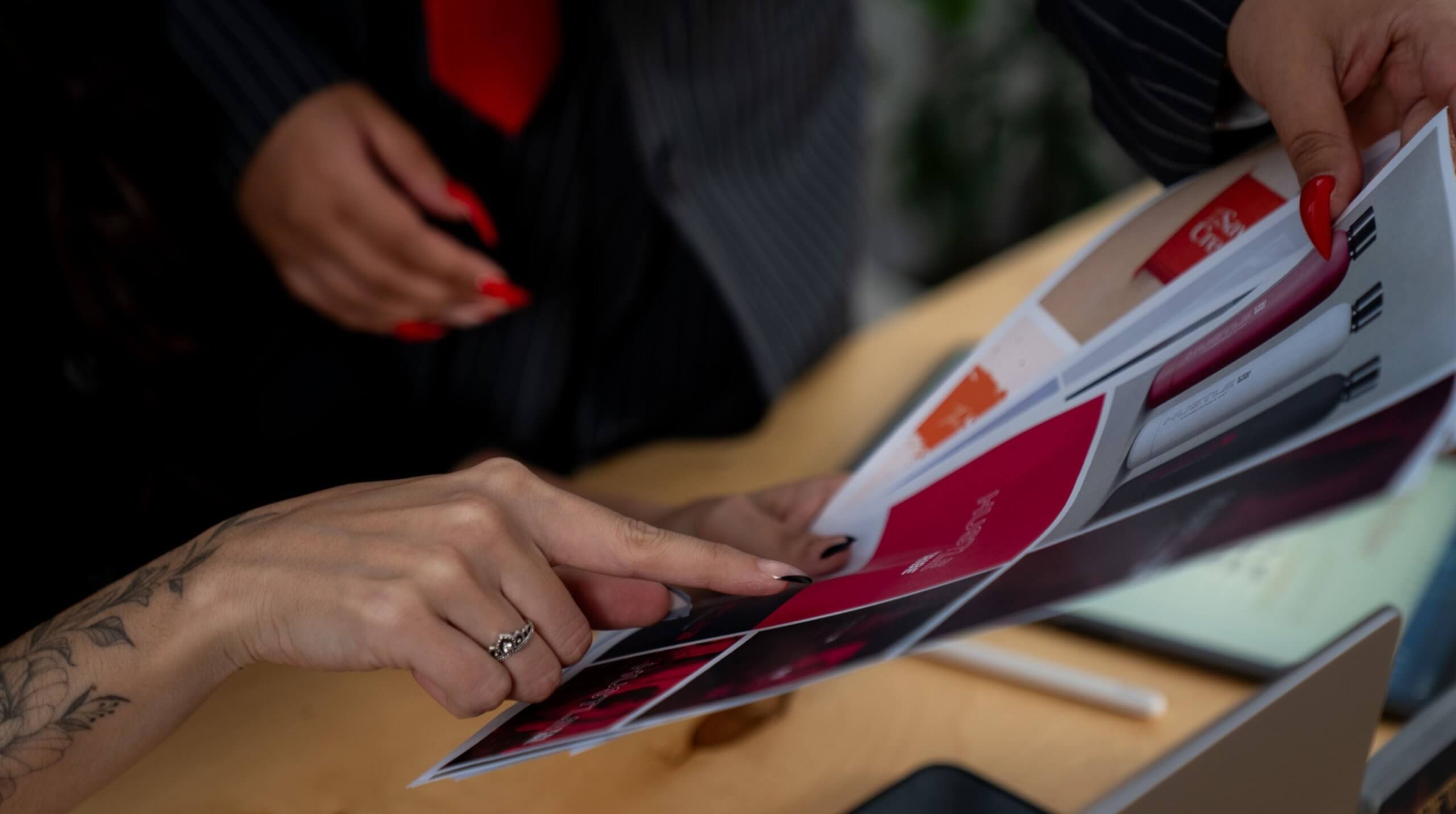 Creative team reviewing mockups – branding tips for service-based businesses.