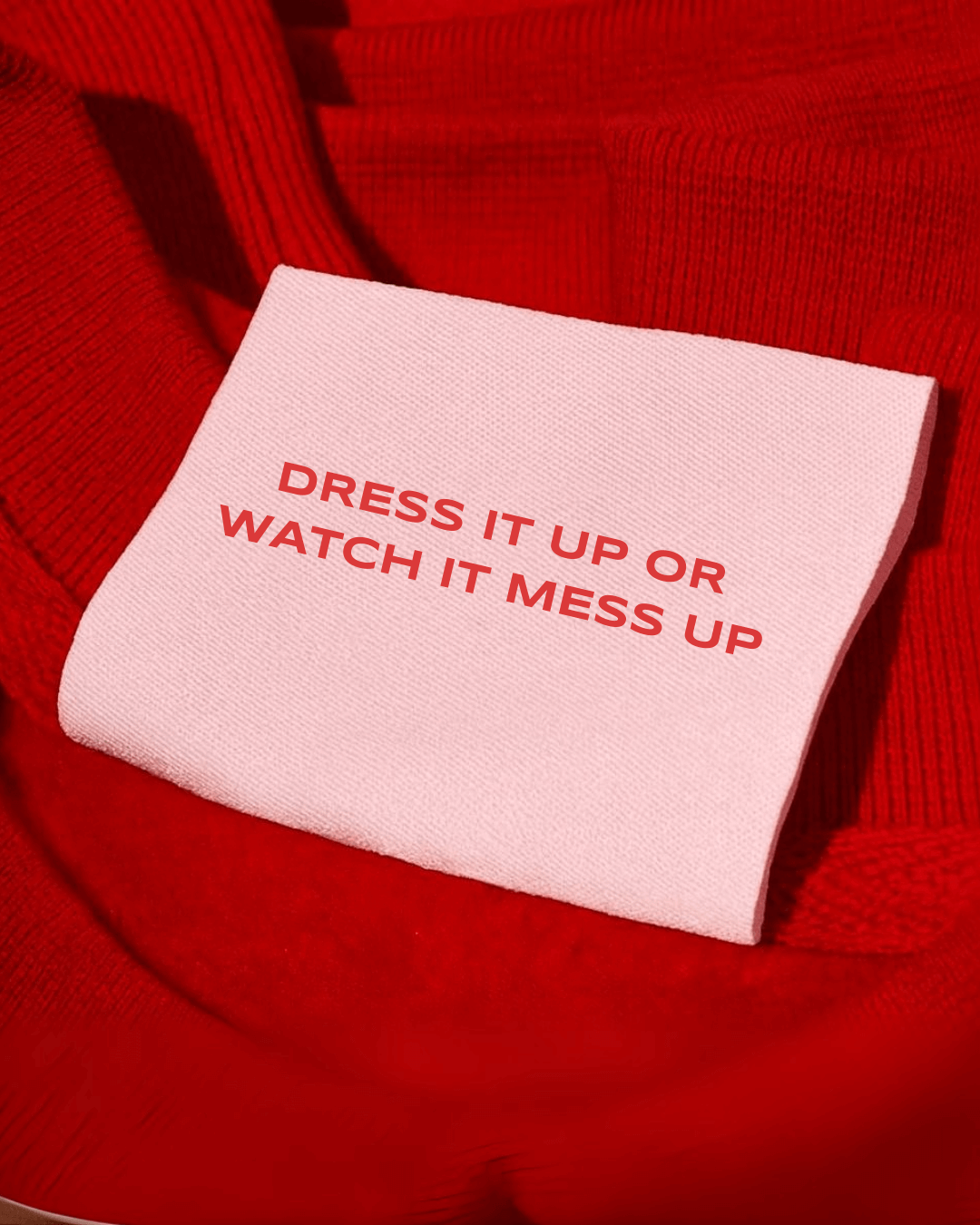 Dress your brand right Pink fabric label on red cloth with bold text reading Dress it up or watch it mess up